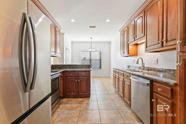 kitchen with light tile patterned flooring, a sink, visible vents, appliances with stainless steel finishes, and an inviting chandelier