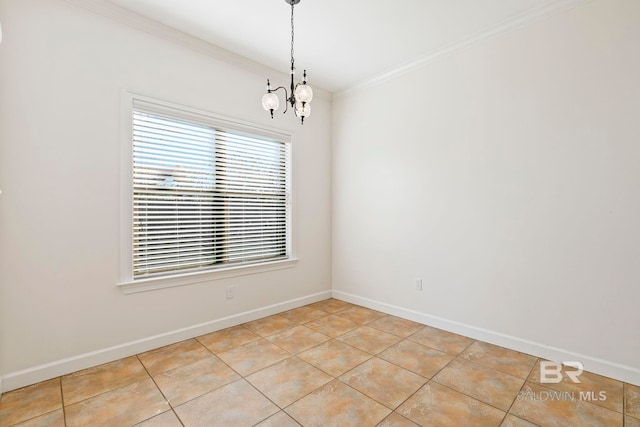 spare room with a chandelier, ornamental molding, light tile patterned floors, and baseboards