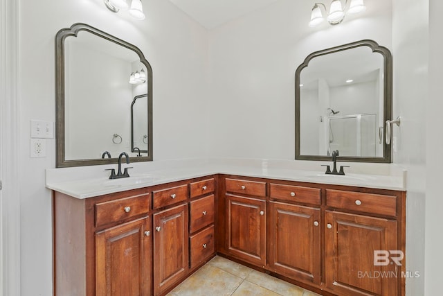 bathroom featuring tile patterned flooring, vanity, and an enclosed shower