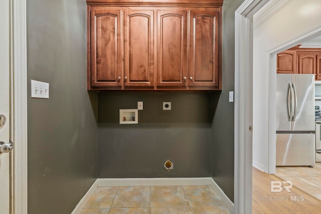 laundry area featuring electric dryer hookup, cabinets, and washer hookup