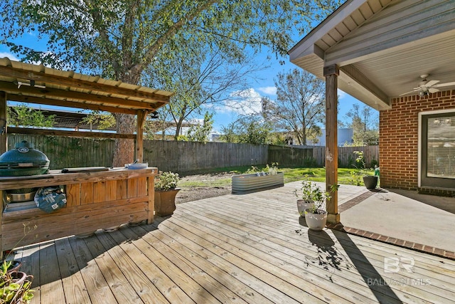 wooden deck featuring ceiling fan