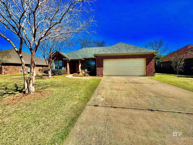 ranch-style house featuring a front yard, brick siding, driveway, and an attached garage