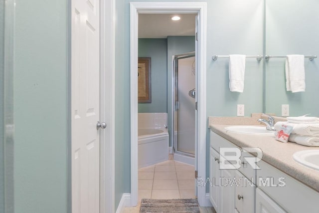 455 E Beach Blvd Unit 1505, Gulf Shores, AL 36542 - full bath featuring tile patterned floors, double vanity, a bath, a sink, and a stall shower