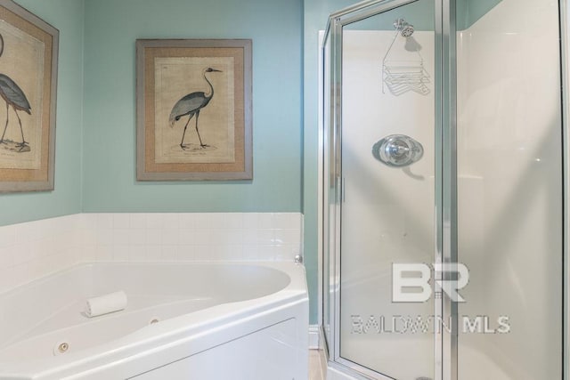 455 E Beach Blvd Unit 1505, Gulf Shores, AL 36542 - bathroom featuring a shower stall and a bath