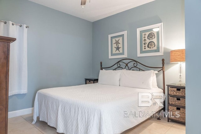 455 E Beach Blvd Unit 1505, Gulf Shores, AL 36542 - tiled bedroom with a ceiling fan and baseboards