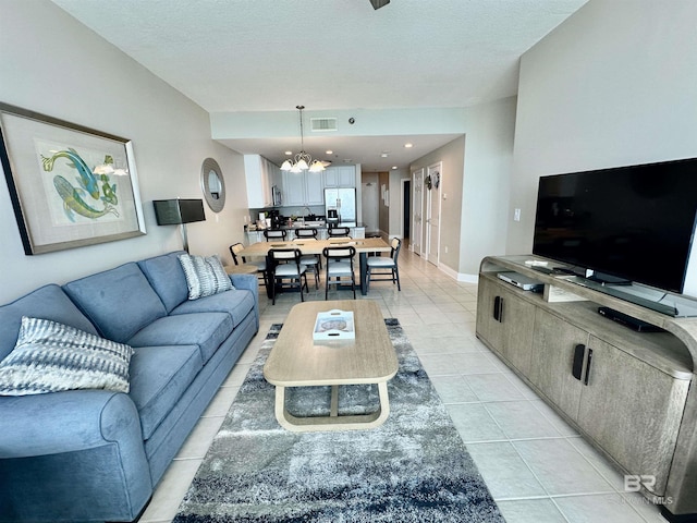 455 E Beach Blvd Unit 1505, Gulf Shores, AL 36542 - living area featuring light tile patterned floors, a textured ceiling, visible vents, and a chandelier