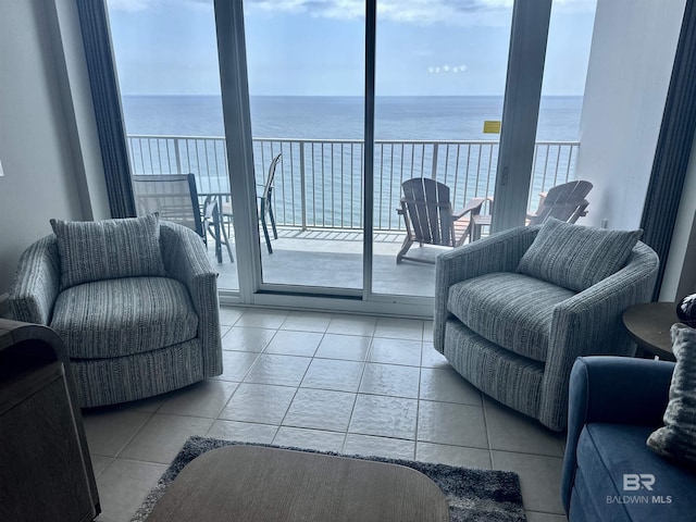 455 E Beach Blvd Unit 1505, Gulf Shores, AL 36542 - living room featuring light tile patterned floors and a water view