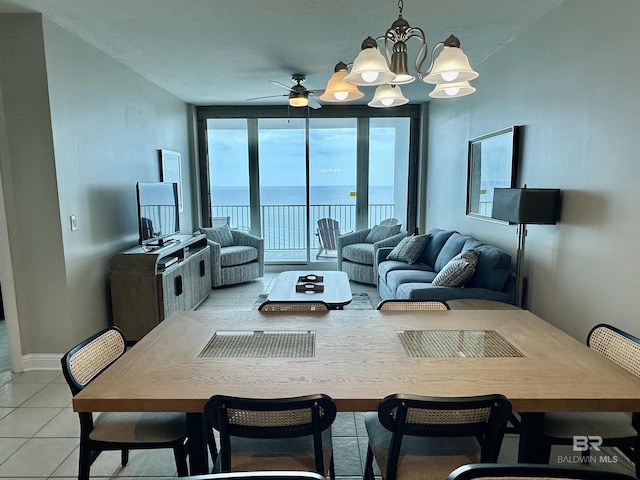 455 E Beach Blvd Unit 1505, Gulf Shores, AL 36542 - dining space featuring a wall of windows, light tile patterned floors, and ceiling fan with notable chandelier