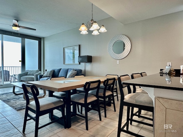 455 E Beach Blvd Unit 1505, Gulf Shores, AL 36542 - dining space with light tile patterned floors and ceiling fan with notable chandelier