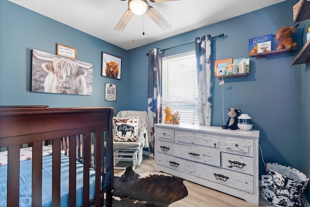 bedroom featuring ceiling fan and wood-type flooring