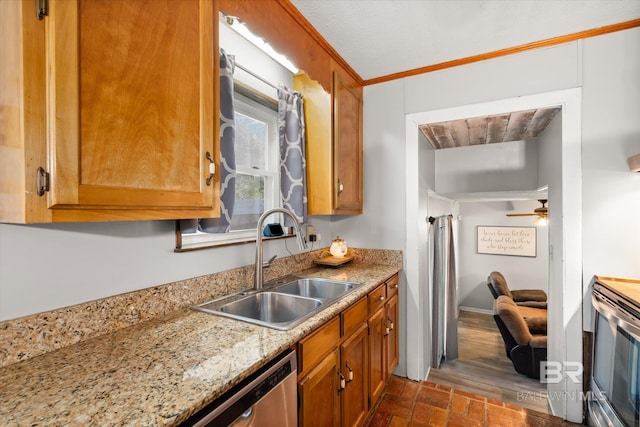 kitchen with stainless steel appliances, light stone countertops, ceiling fan, ornamental molding, and sink