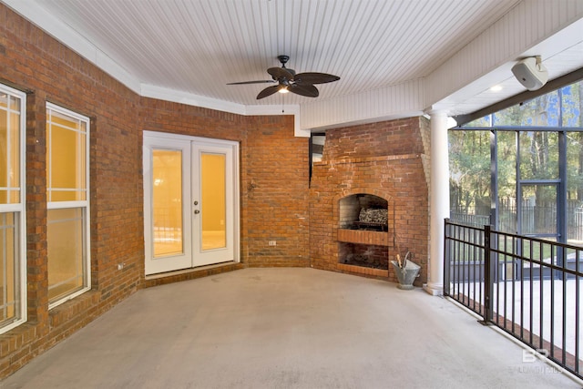 view of patio / terrace featuring french doors, an outdoor brick fireplace, and ceiling fan