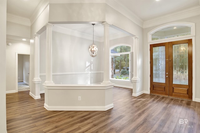 entrance foyer featuring french doors, dark hardwood / wood-style floors, and crown molding