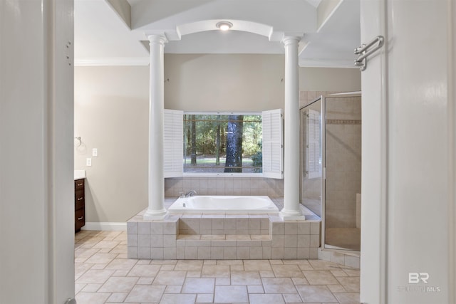 bathroom with vanity, ornate columns, and shower with separate bathtub