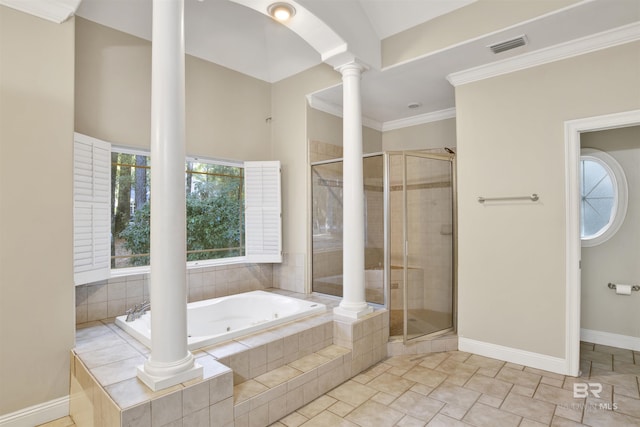 bathroom with decorative columns, shower with separate bathtub, and ornamental molding