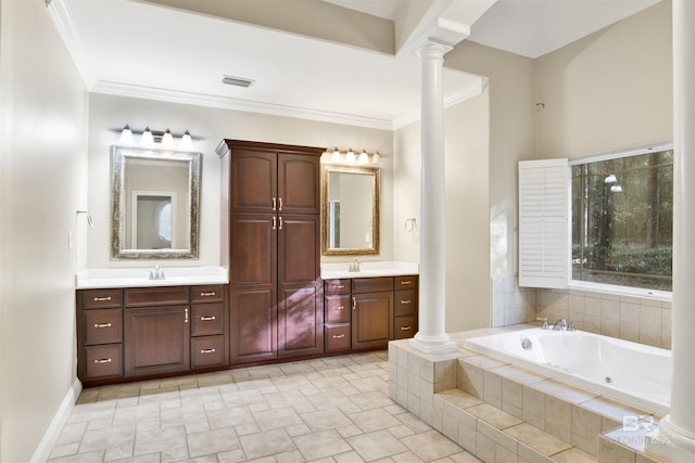 bathroom with vanity, ornamental molding, tiled tub, and ornate columns