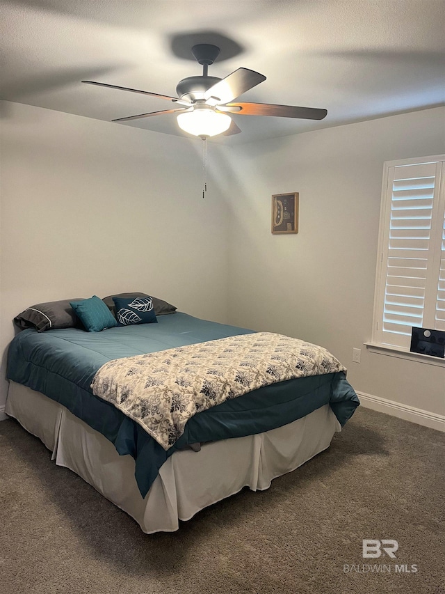 bedroom featuring baseboards, carpet, and ceiling fan