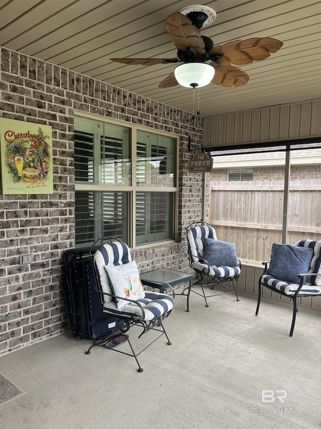 view of patio / terrace featuring ceiling fan and fence