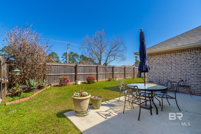 view of patio / terrace with a fenced backyard and outdoor dining space