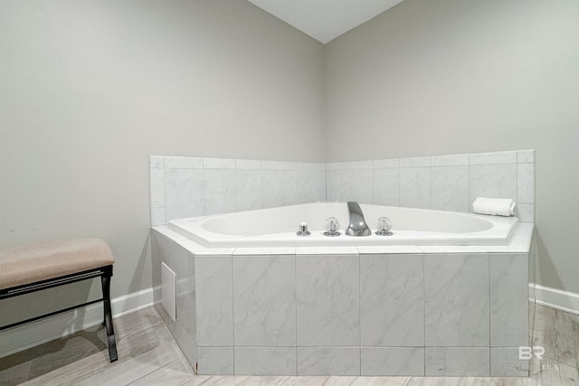 bathroom with tiled bath