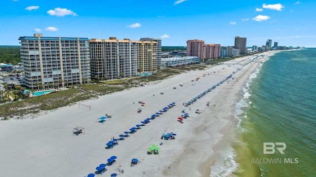 bird's eye view featuring a beach view and a water view