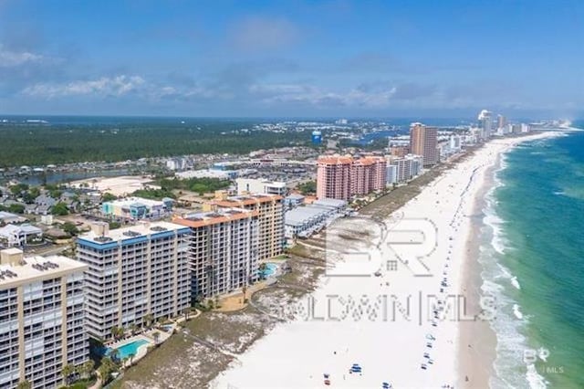 aerial view featuring a water view and a beach view