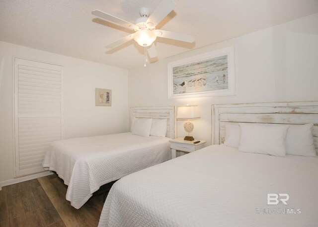 bedroom featuring dark hardwood / wood-style floors and ceiling fan