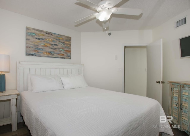 bedroom featuring dark hardwood / wood-style floors and ceiling fan