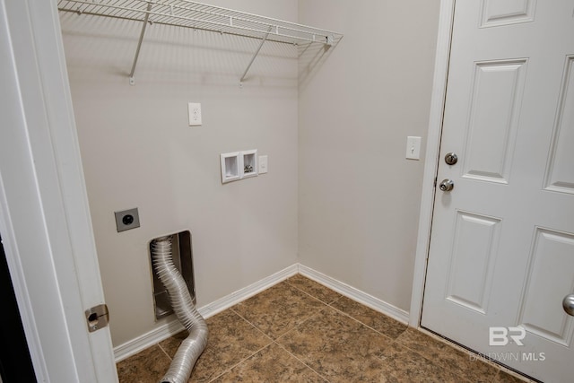 clothes washing area featuring hookup for an electric dryer, dark tile patterned floors, and hookup for a washing machine