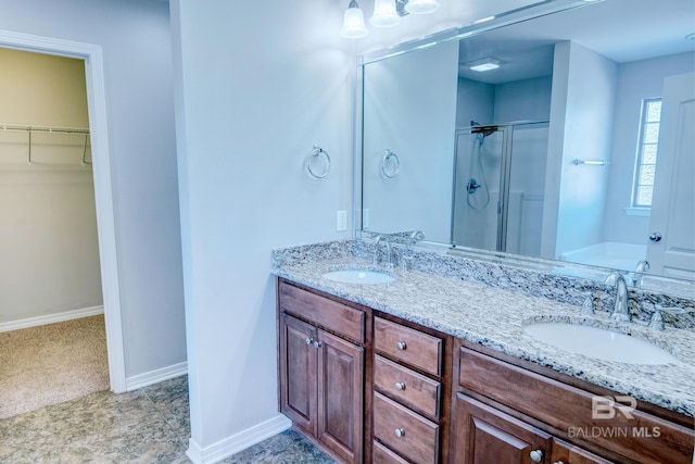 bathroom featuring separate shower and tub and vanity