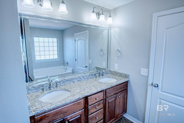 bathroom featuring vanity and a tub