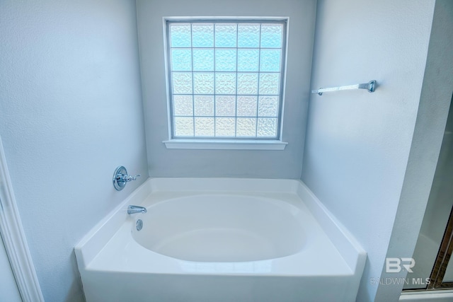 bathroom featuring a bath