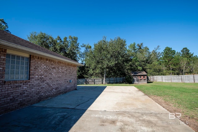 view of patio / terrace featuring a storage shed