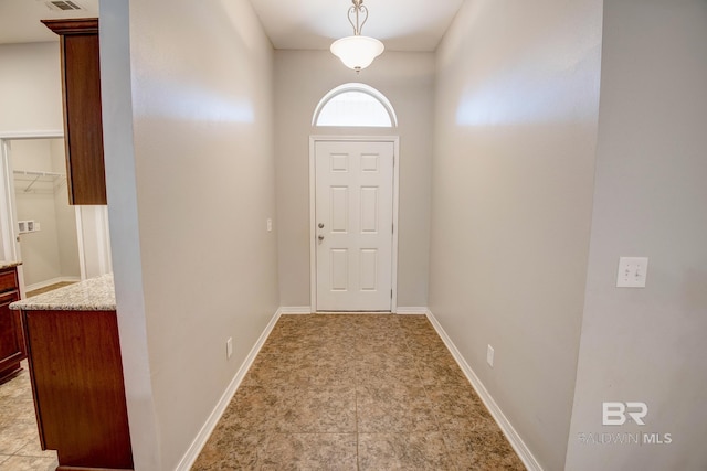 entryway featuring light tile patterned floors