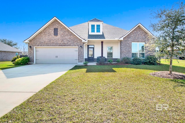 view of front of property with a garage and a front yard