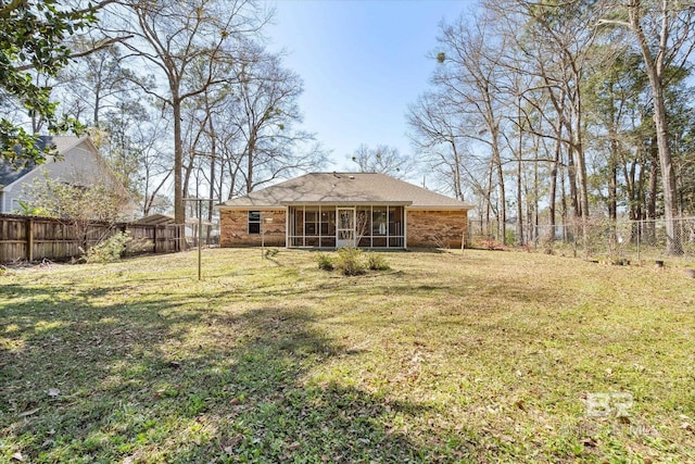 view of yard with a fenced backyard and a sunroom