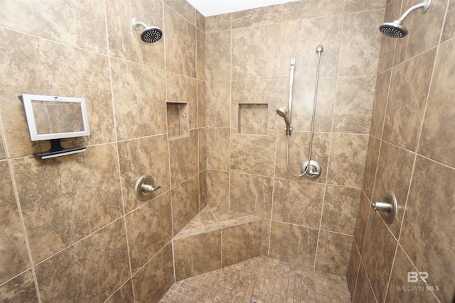 bathroom featuring tiled shower