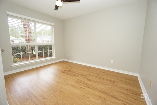 unfurnished room with ceiling fan and light wood-type flooring