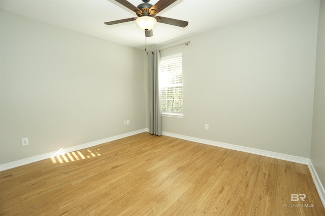 spare room with light hardwood / wood-style flooring and ceiling fan