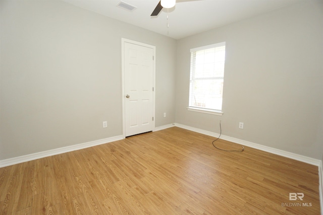 spare room featuring ceiling fan and light wood-type flooring