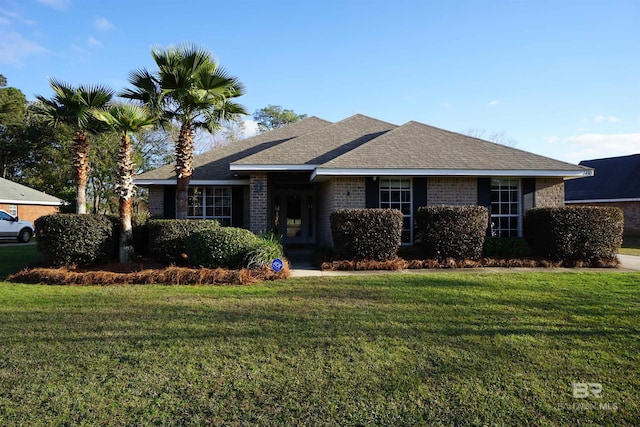 ranch-style home with a front yard