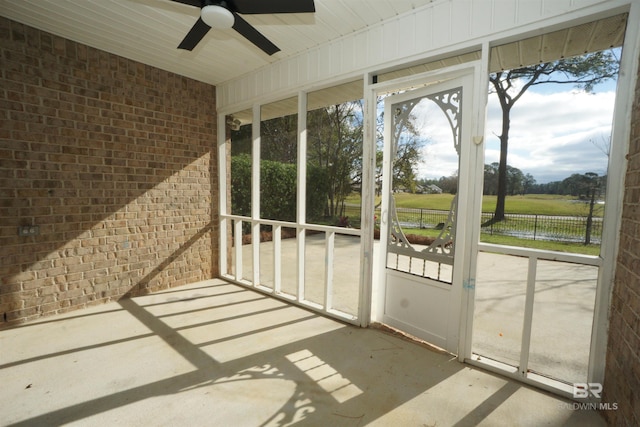 sunroom featuring ceiling fan