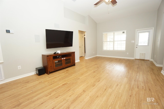 unfurnished living room with ceiling fan, light hardwood / wood-style floors, and vaulted ceiling