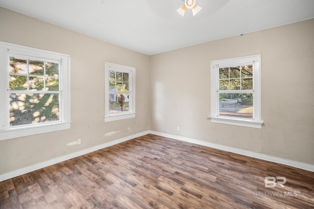 empty room featuring wood-type flooring and ceiling fan