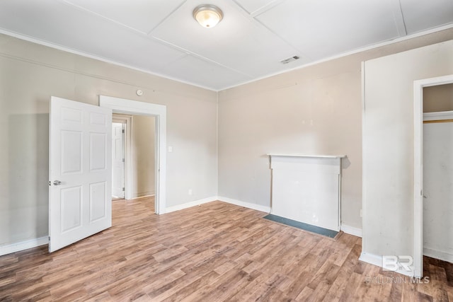 spare room featuring wood-type flooring