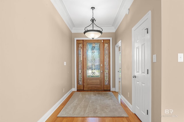 entrance foyer featuring light wood-type flooring and crown molding