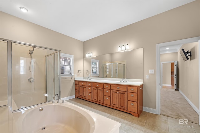 bathroom featuring separate shower and tub, tile patterned flooring, and vanity