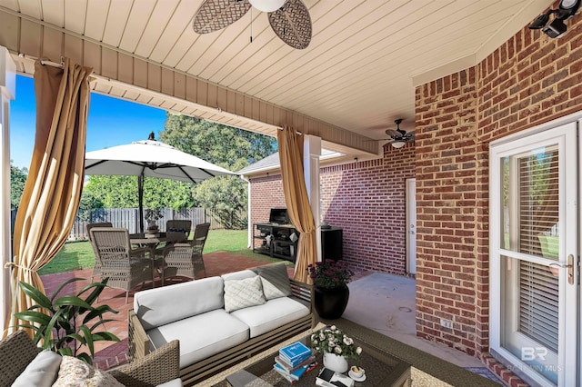 view of patio with outdoor lounge area and ceiling fan