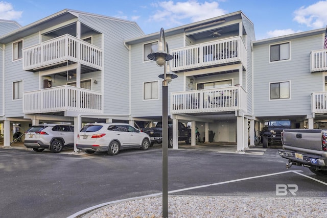 25861 Canal Rd Unit 44, Orange Beach, AL 36561 - view of building exterior featuring covered and uncovered parking