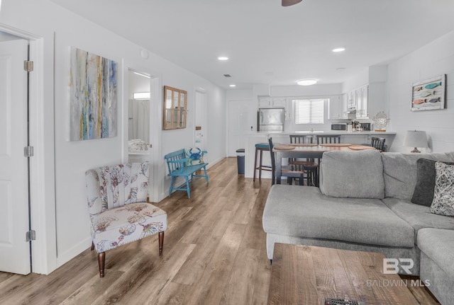 living room with light hardwood / wood-style flooring